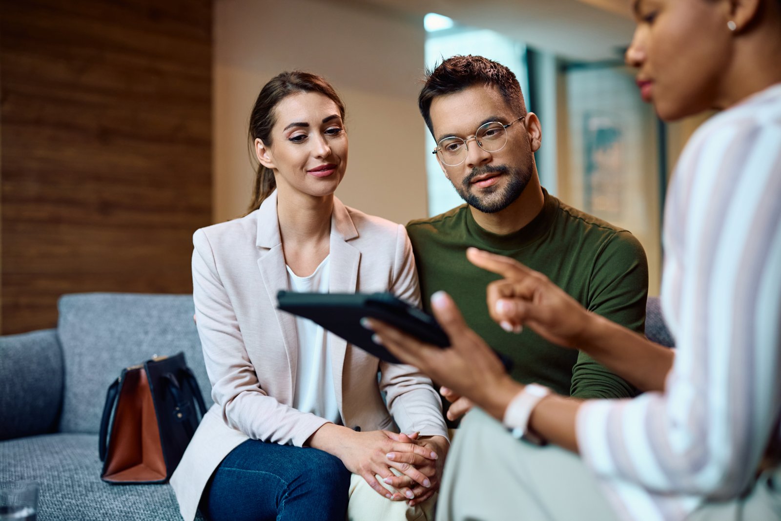 Young couple using the blockchain in Insurtech to learn about insurance